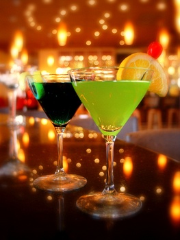 A pair of martinis on a bar